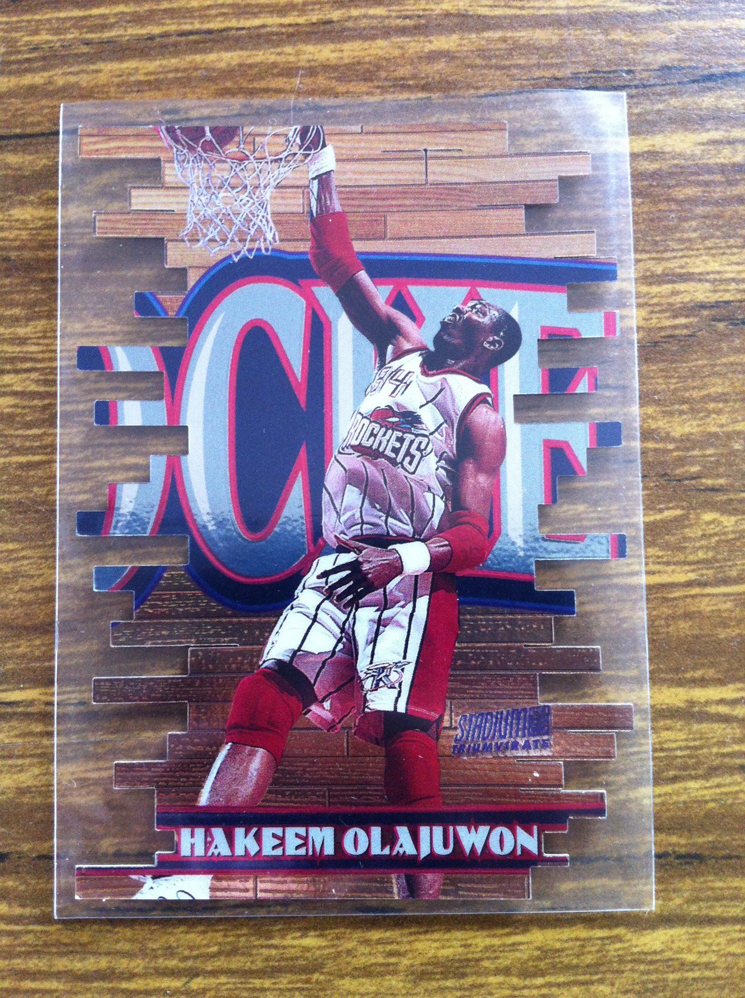 1997-98 Stadium Club Triumvirate Hakeem Olajuwon (F).JPG