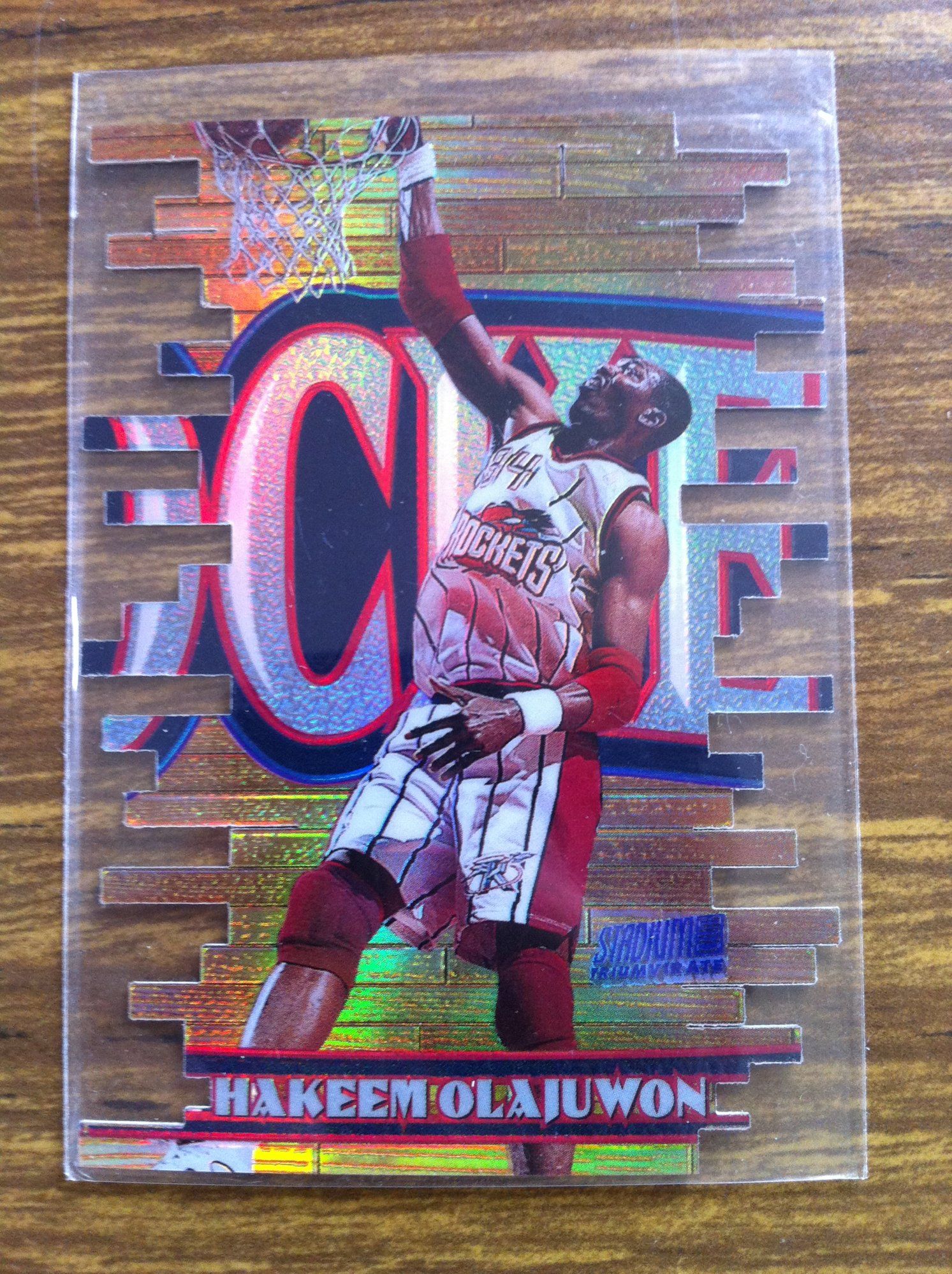 1997-98 Stadium Club Triumvirate Luminescent Hakeem Olajuwon (F).JPG