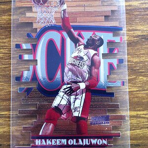 1997-98 Stadium Club Triumvirate Hakeem Olajuwon (F).JPG